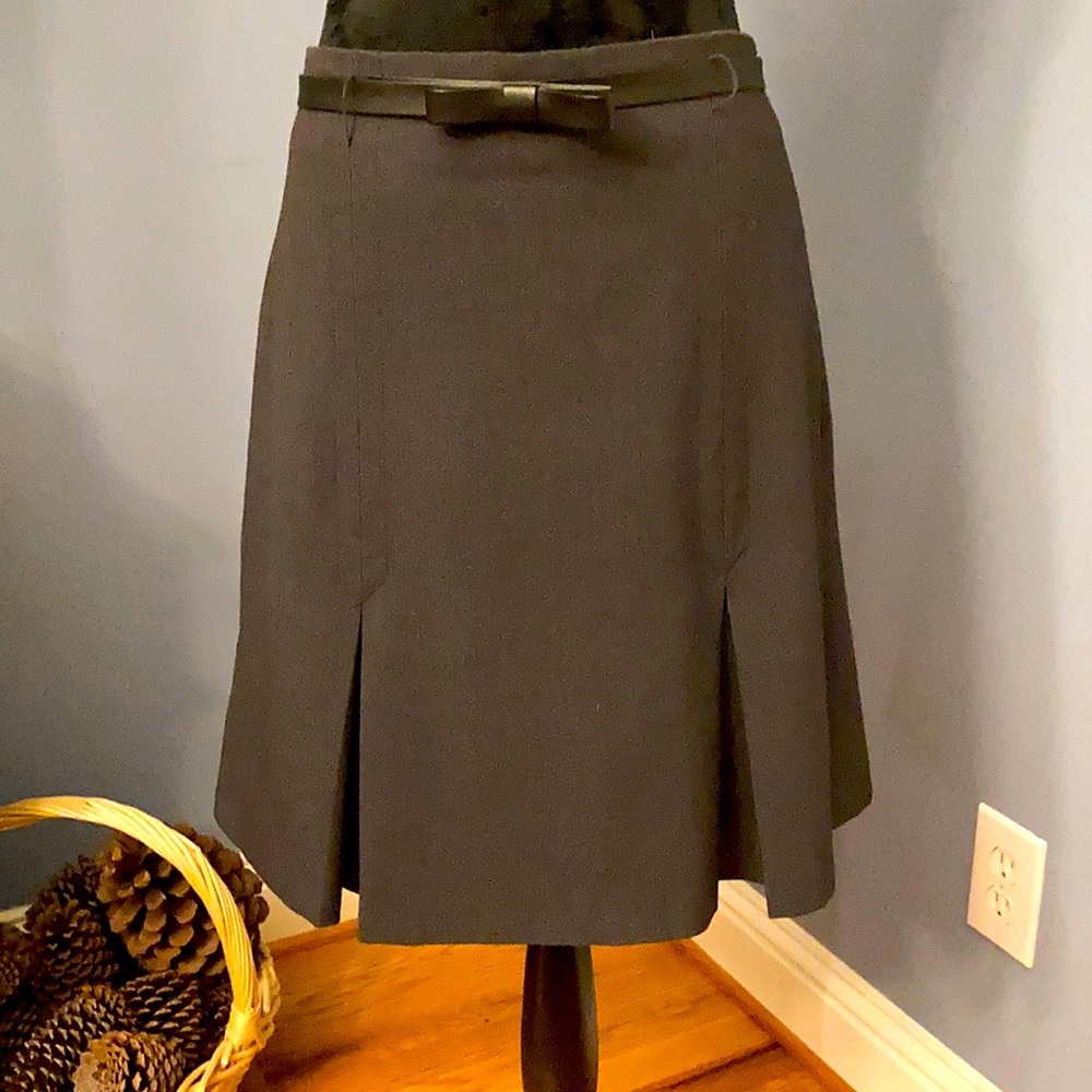 Grey box pleat skirt with bow belt.